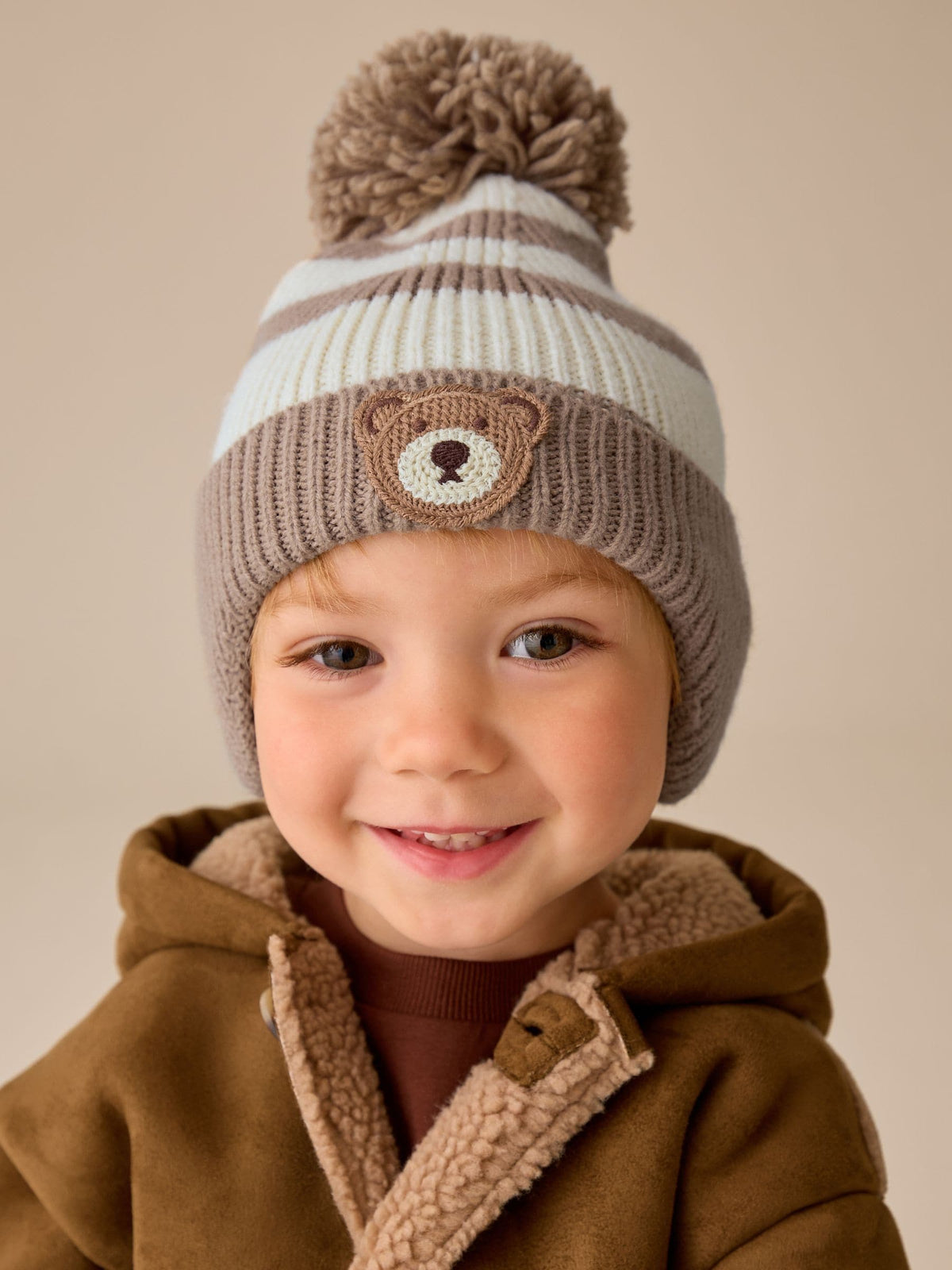 Neutral Knitted Pom Hat (3mths-10yrs) - image 1