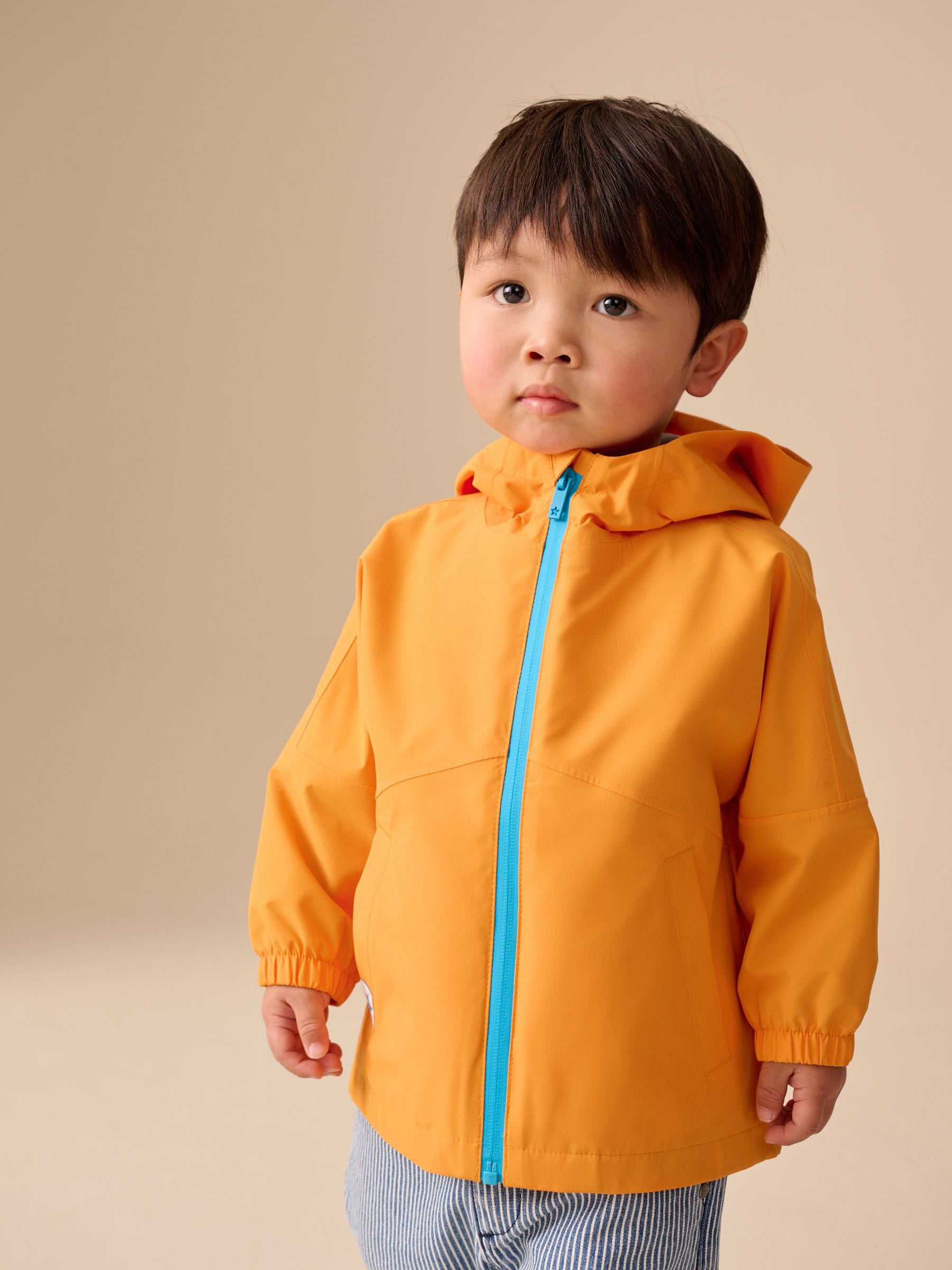 Dsiney Kidz - Orange Waterproof Cagoule (3mths-7yrs) image 1